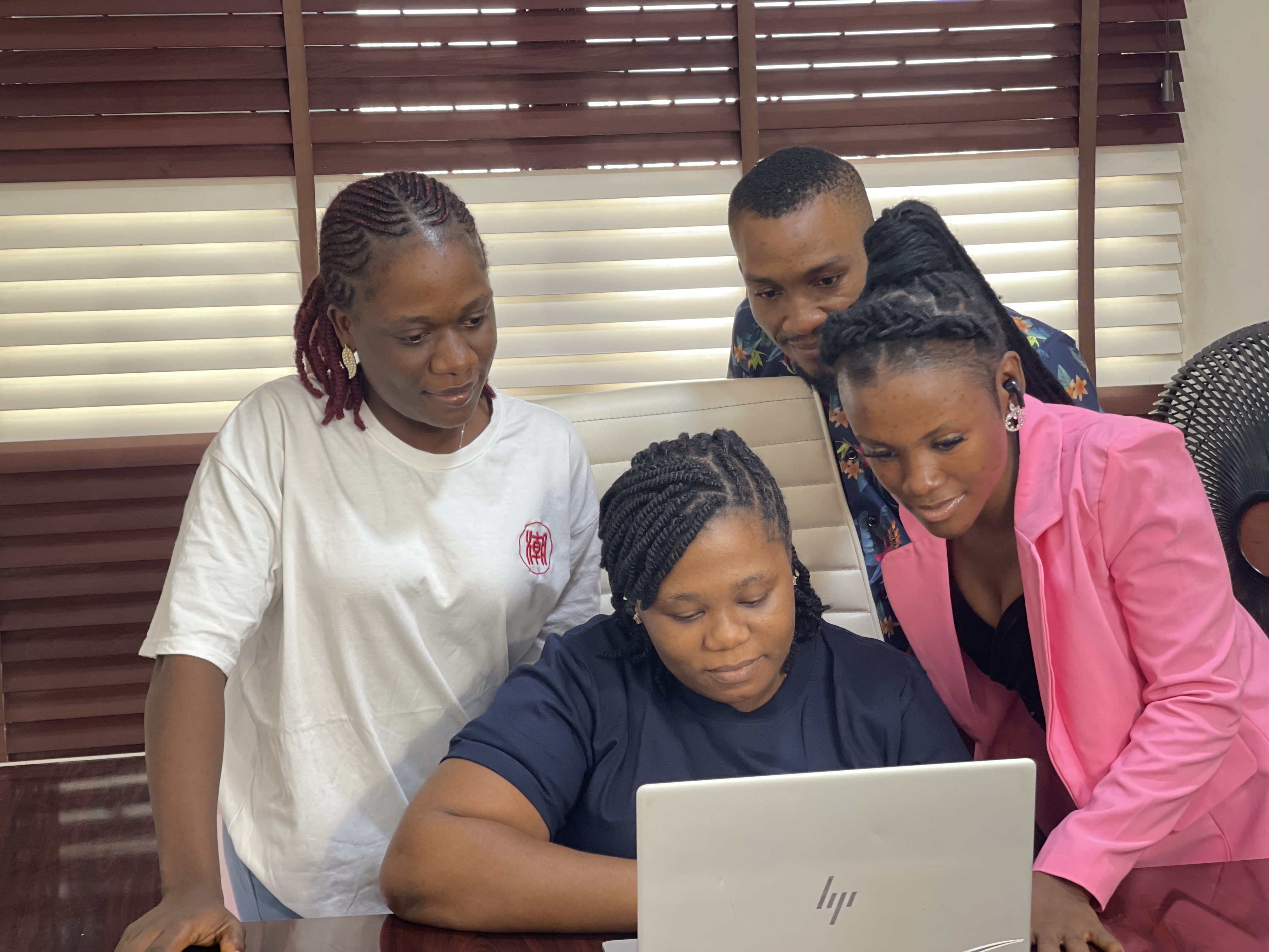 Team-looking-at-laptop